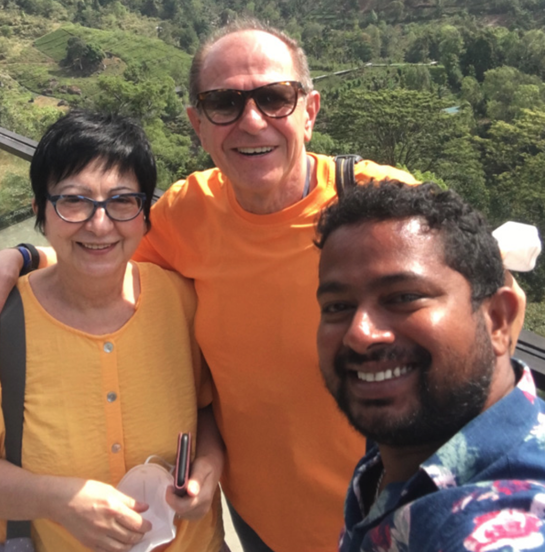Travellers with their Sri Lanka driver at a hill-country viewpoint