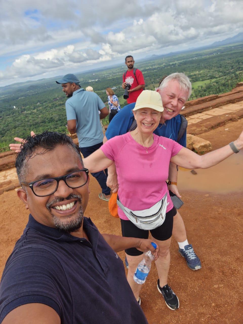 Chauffeur guide taking a selfie with travellers near Sigiriya in Sri Lanka