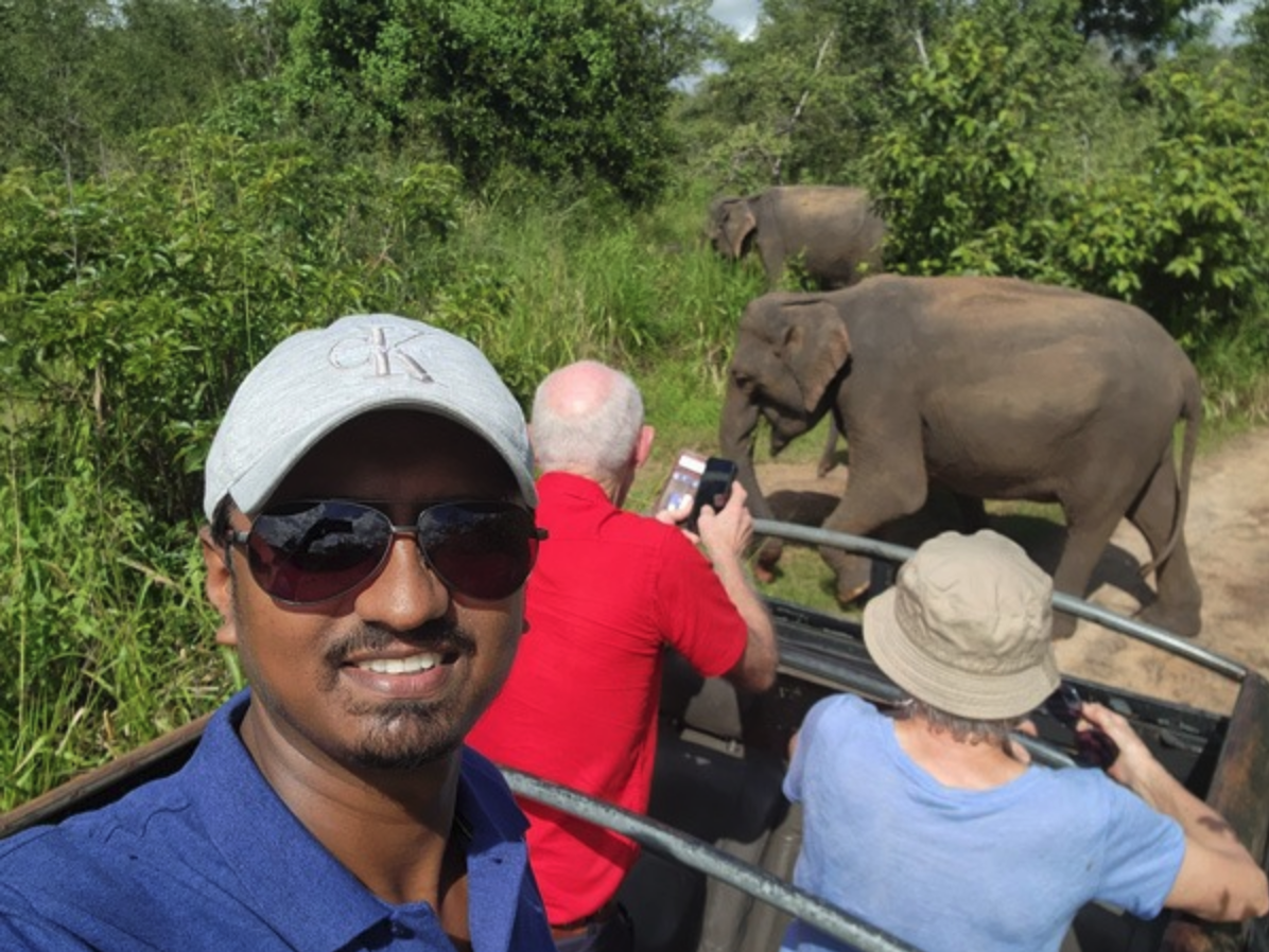 Travelling couple and their private driver during a Sri Lanka road journey
